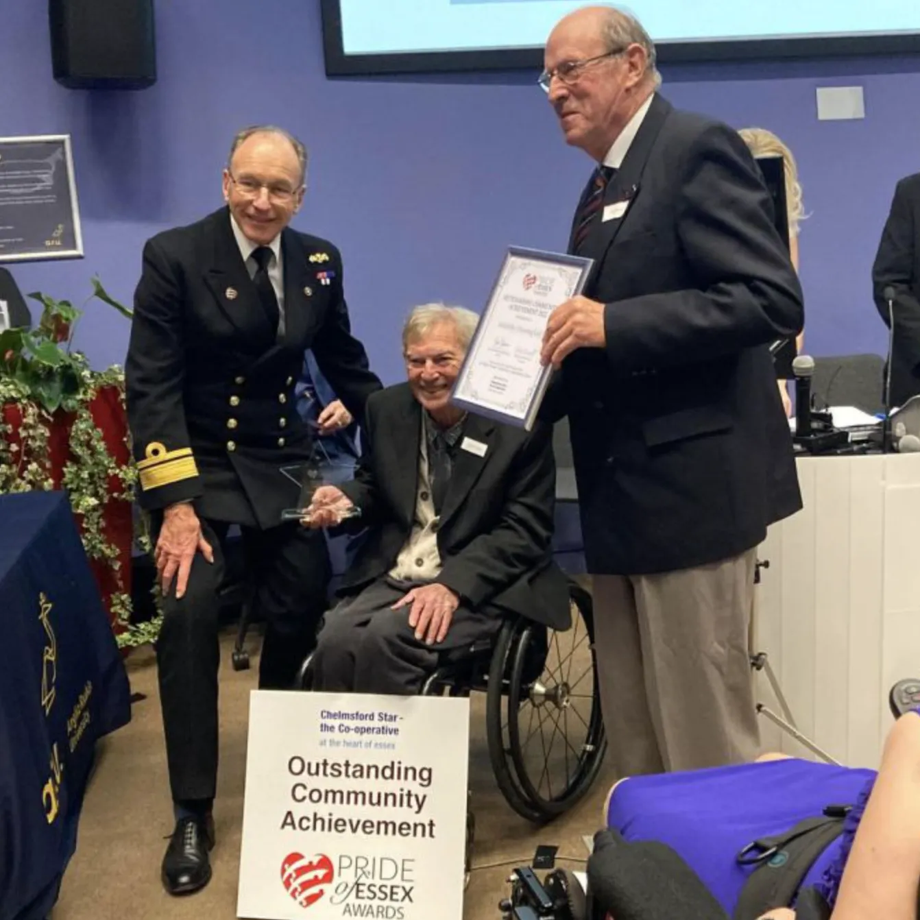 A delegate from Sailability receiving the Pride of Essex Outstanding Communiyu Achievement Award in 2022.